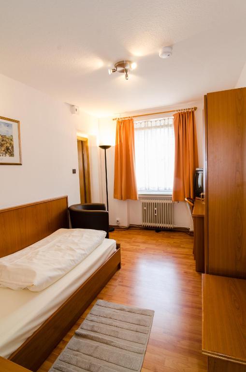 Postel nebo postele na pokoji v ubytování Altstadthotel Wienecke