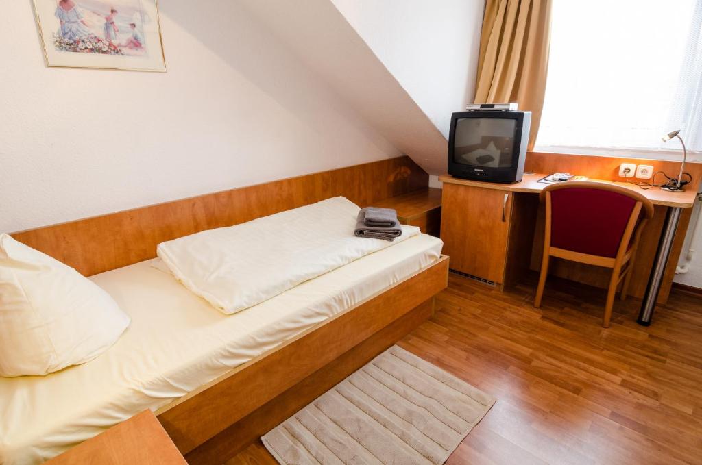 TV a/nebo společenská místnost v ubytování Altstadthotel Wienecke