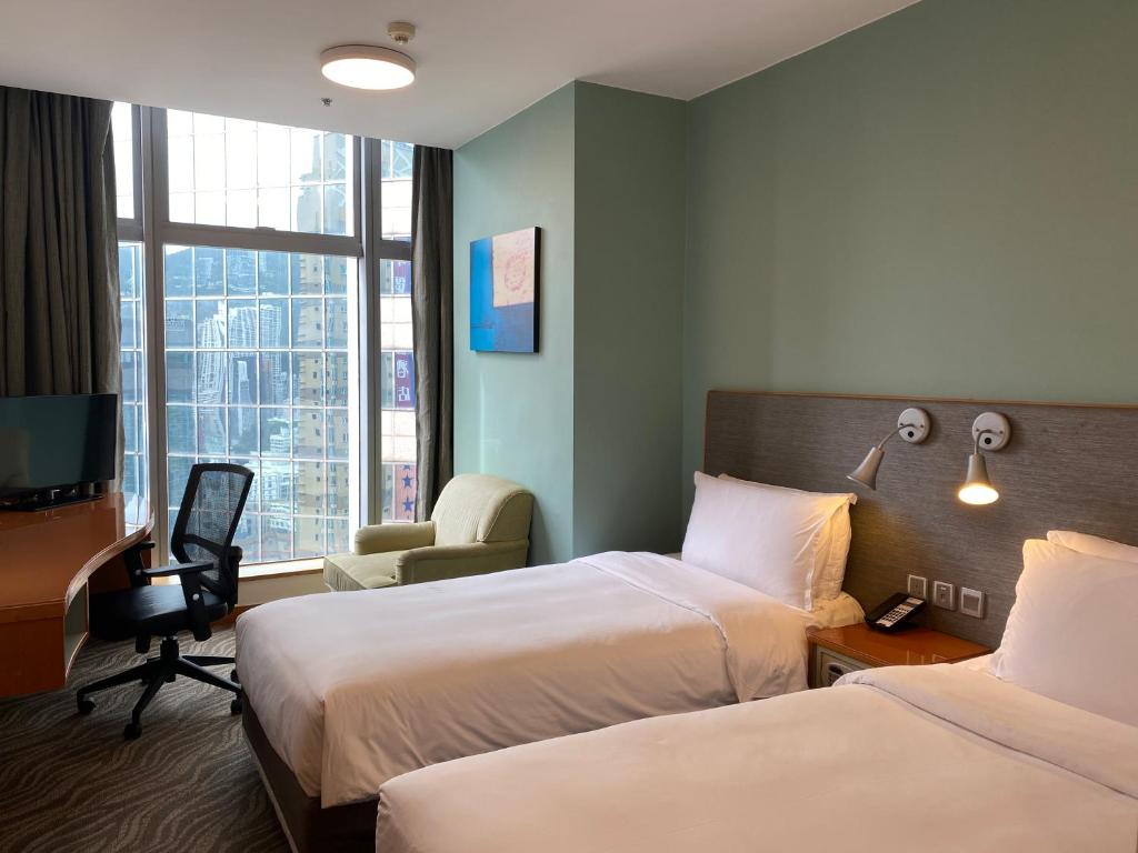Postel nebo postele na pokoji v ubytování Holiday Inn Express Hong Kong Causeway Bay by IHG