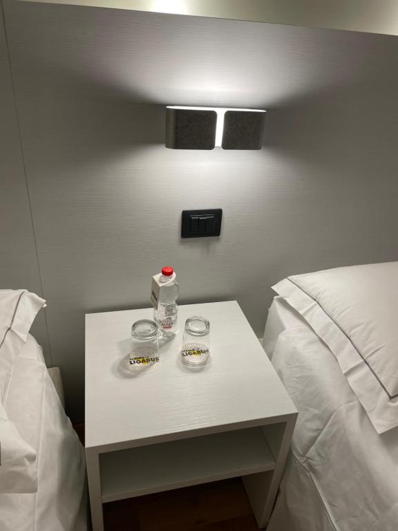 Postel nebo postele na pokoji v ubytování Albergo Ligabue