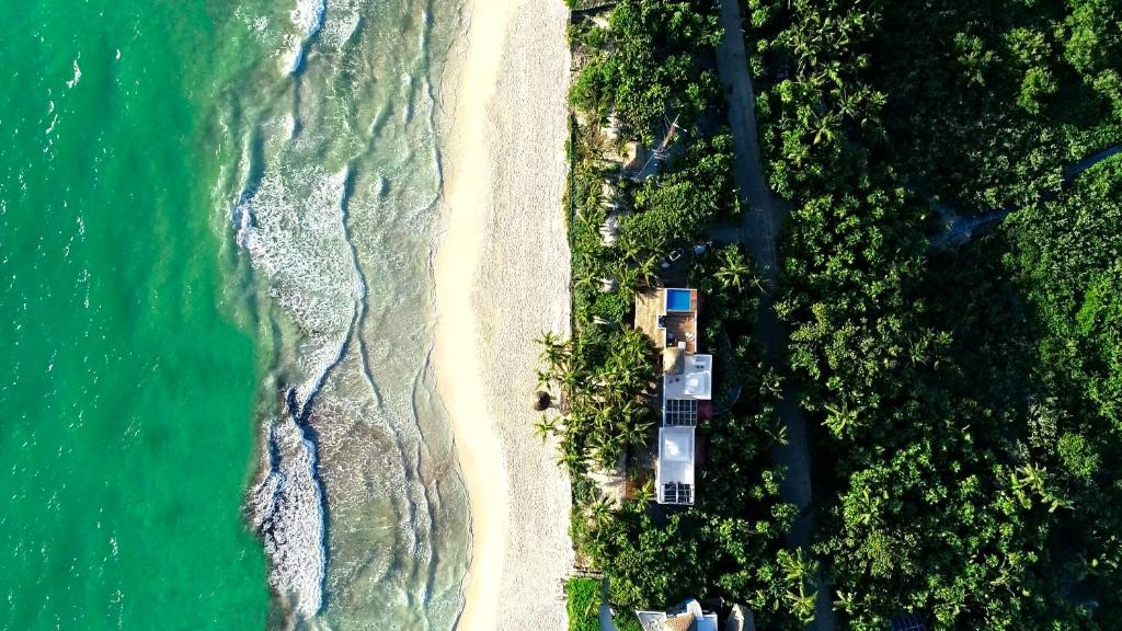an overhead view of a beach and the ocean at Villa Destiny Tulum beach front luxury villa in Tulum