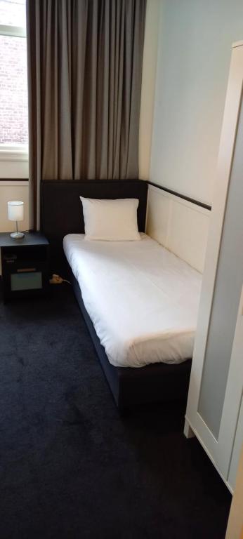 Een bed of bedden in een kamer bij Stad & Strandhotel Elisabeth