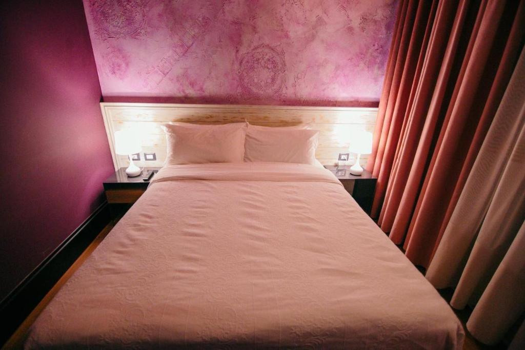 Postel nebo postele na pokoji v ubytování Cathedral Boutique Hotel