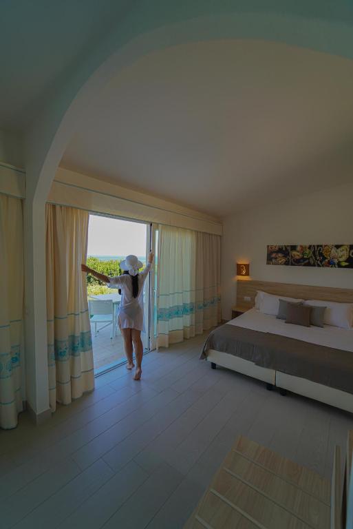 Postel nebo postele na pokoji v ubytování GH Santina Resort & SPA