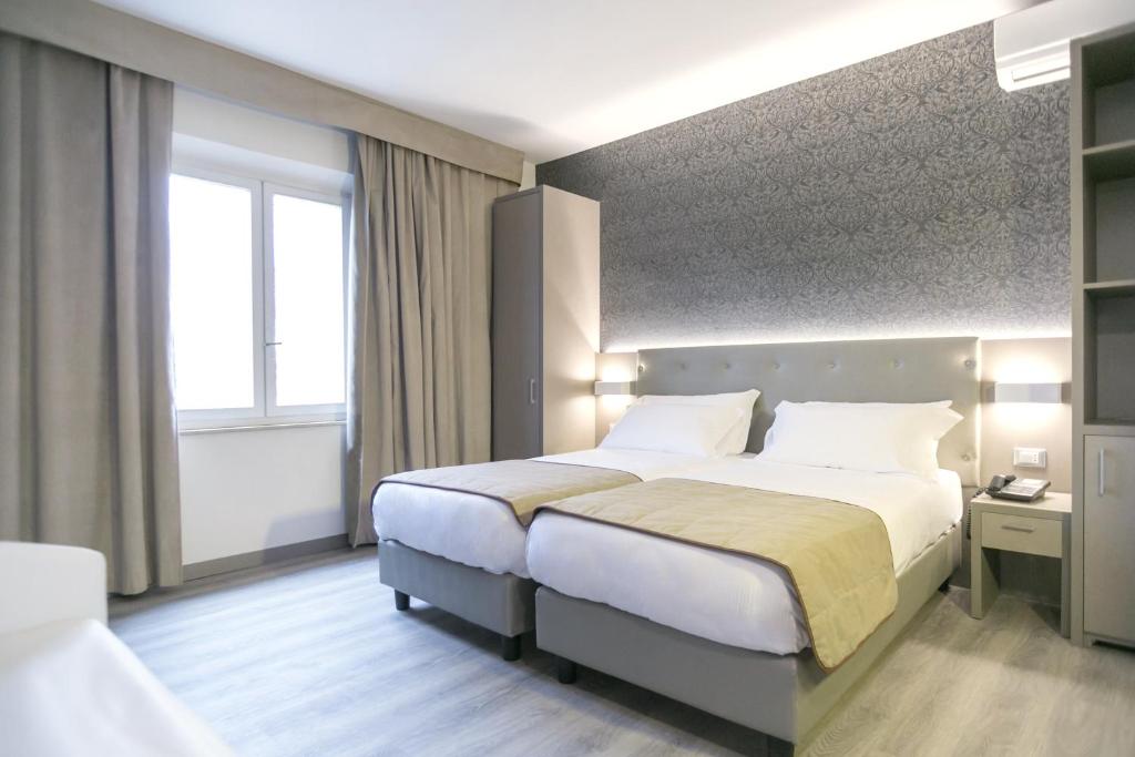 Posteľ alebo postele v izbe v ubytovaní Hotel Principe