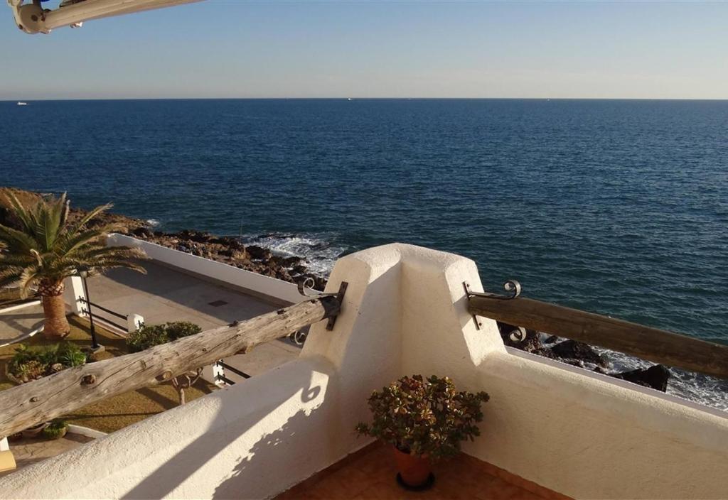 a view of the ocean from a balcony at Sea breeze in Vilanova i la Geltrú