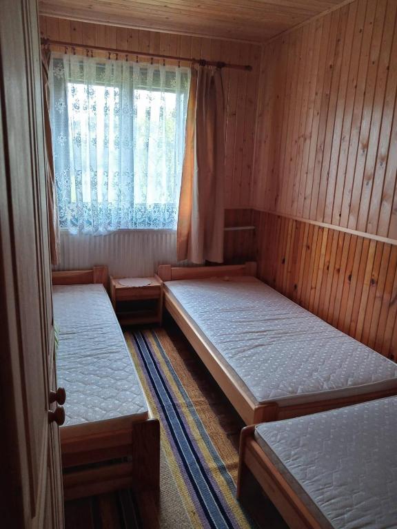 Postel nebo postele na pokoji v ubytování Chata Tereza