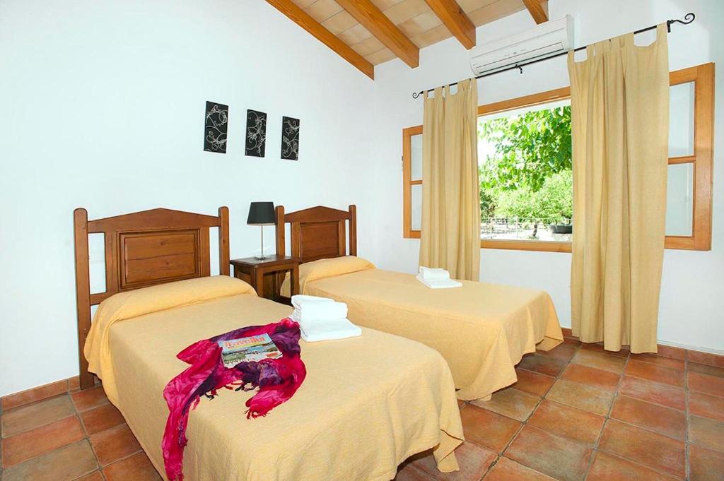 Postel nebo postele na pokoji v ubytování Villa Burgues