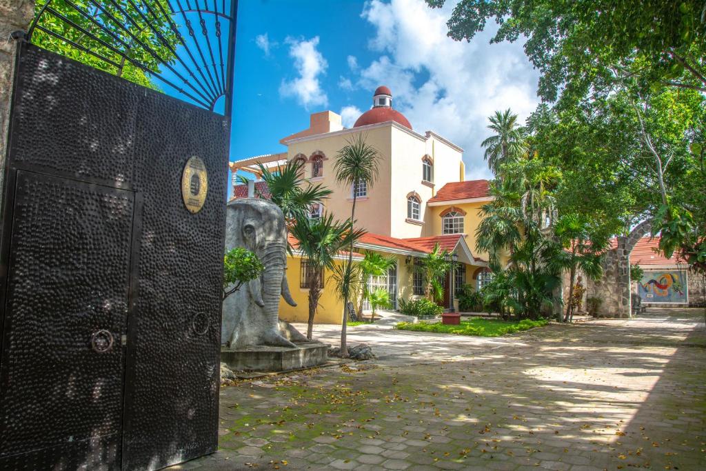 an elephant statue in front of a building at VILLA RODA Luxury & Art in Cancún