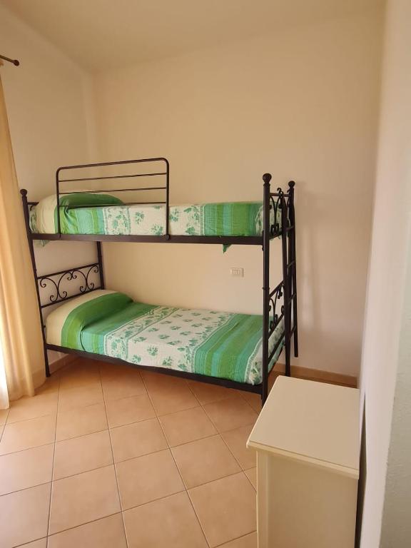 A bed or beds in a room at Dimora San Pietro