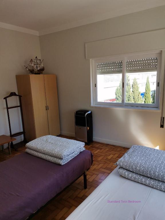 Postel nebo postele na pokoji v ubytování Alex Point - Guest House