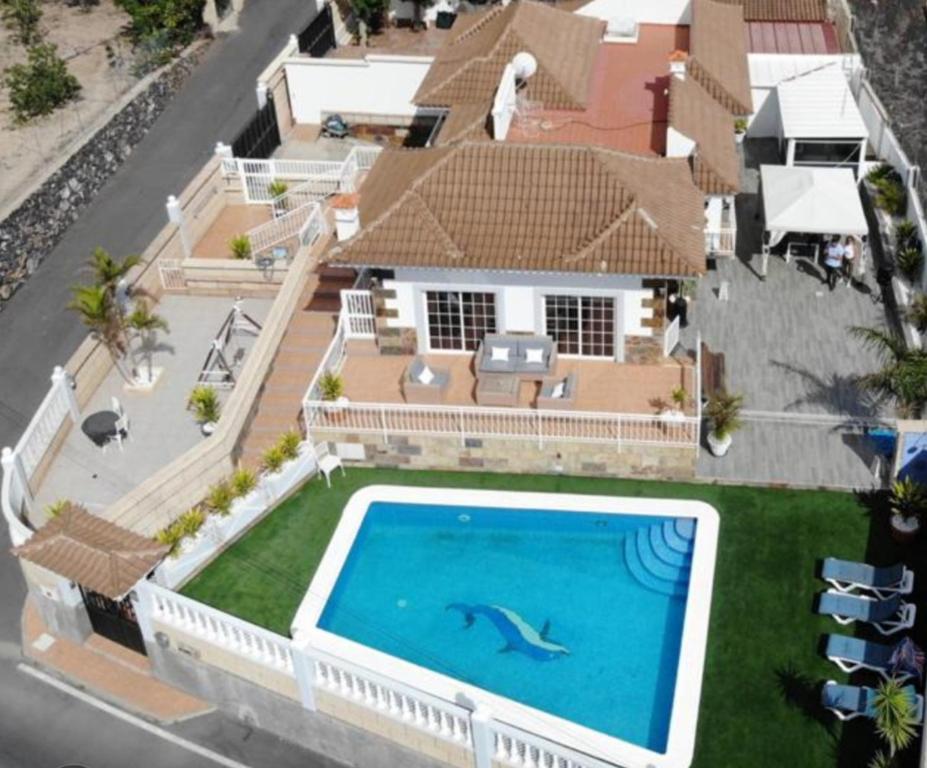 an aerial view of a house with a swimming pool at VILLA GAELCA in Arona