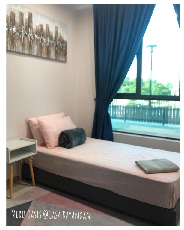 Postel nebo postele na pokoji v ubytování Meru Oasis at Casa Kayangan Ipoh