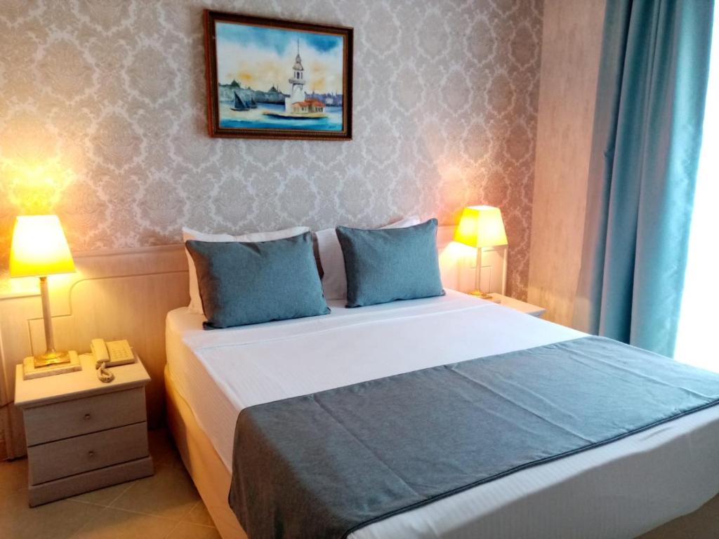 Postel nebo postele na pokoji v ubytování X Life Hotel Sarıgerme 15 - Adult Hotel