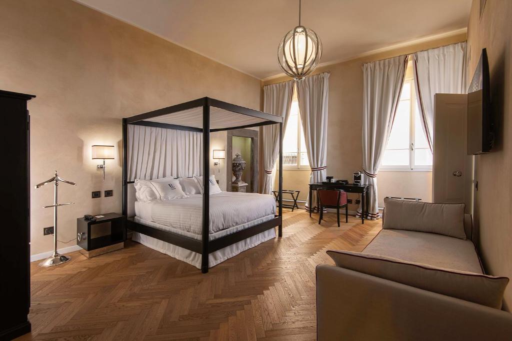 Postel nebo postele na pokoji v ubytování Relais Uffizi