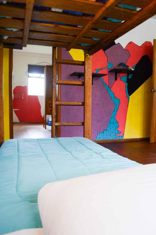 Postel nebo postele na pokoji v ubytování Mama Tungu hostel