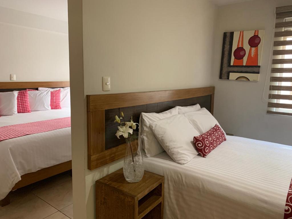 Postel nebo postele na pokoji v ubytování Rymma Hotel
