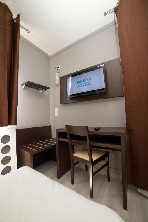 TV a/nebo společenská místnost v ubytování Citadel Hôtel