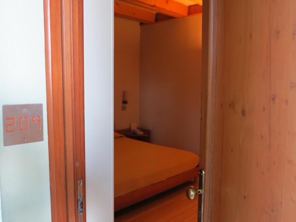 Postel nebo postele na pokoji v ubytování Hotel Della Torre 1850