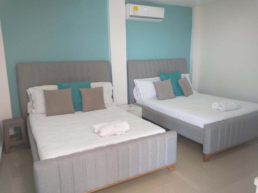 Postel nebo postele na pokoji v ubytování CC House Cartagena