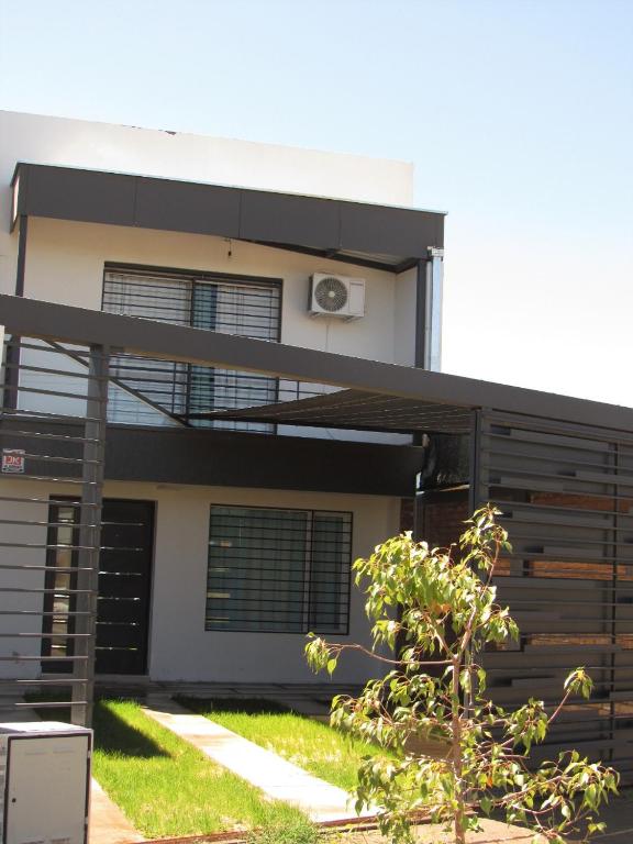 a house with a black and white at Duplex Villanueva in San Rafael