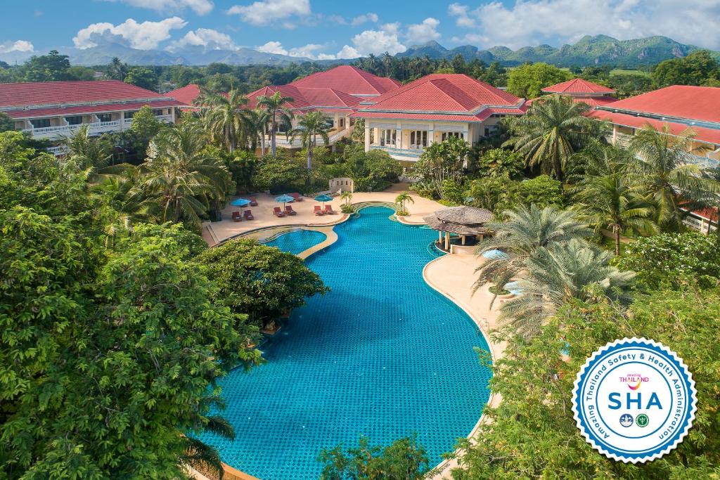 an aerial view of a resort swimming pool at Dheva Mantra Resort in Kanchanaburi