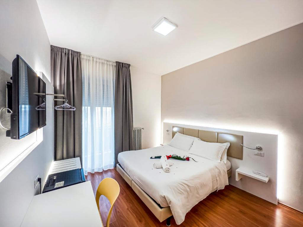 Postel nebo postele na pokoji v ubytování Hotel Gran Sasso & SPA