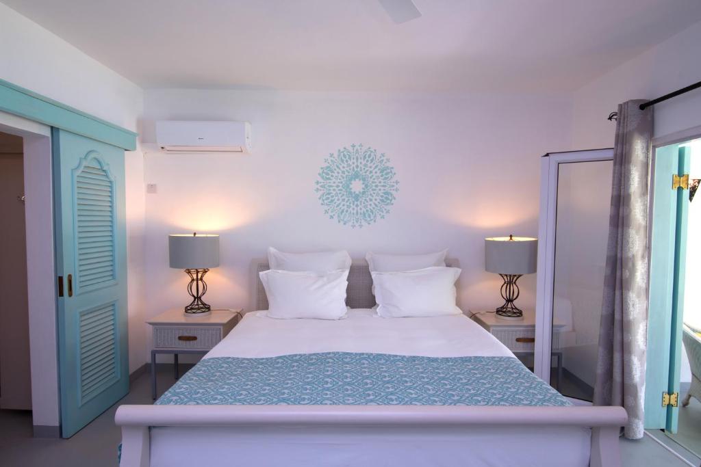 Postel nebo postele na pokoji v ubytování Le Mandala Moris Guesthouse Pointe aux Canonniers