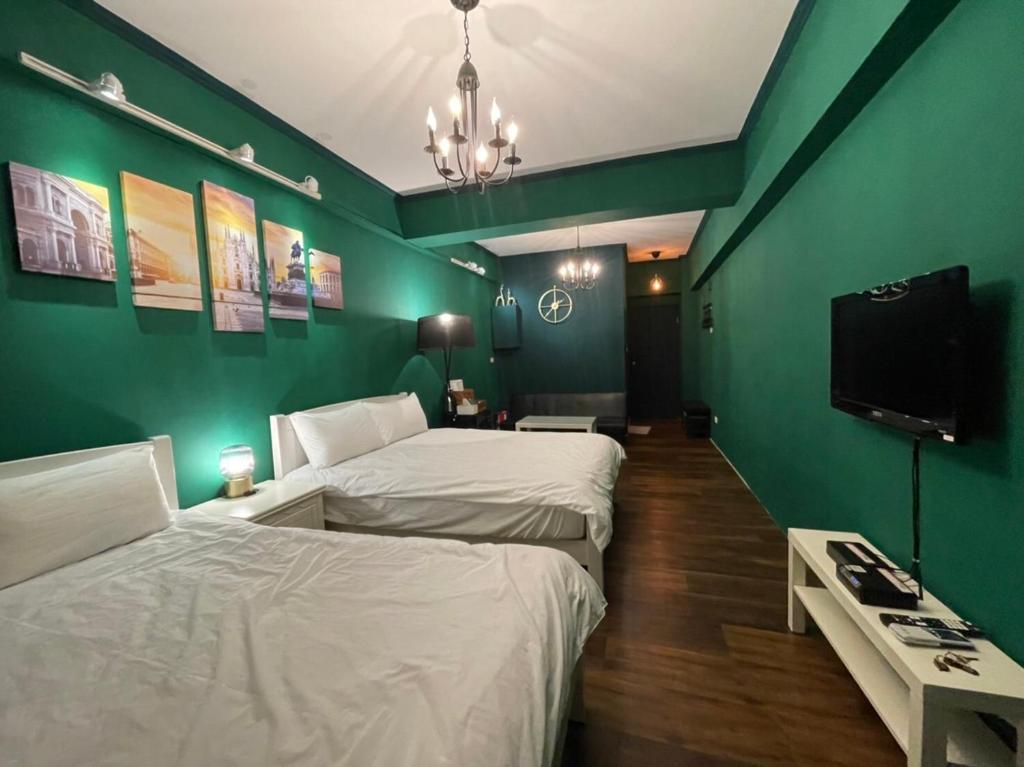 Postel nebo postele na pokoji v ubytování 海沐輕旅 Sea Mu Kenting