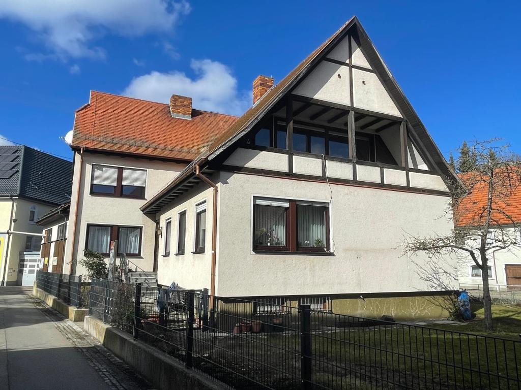 a white house with a black roof at Ferienwohnung im Gerberhaus in Gammertingen