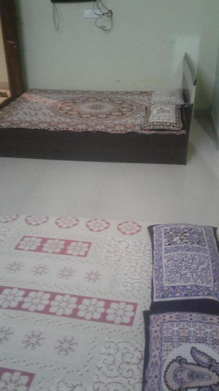 A bed or beds in a room at Xavier Guest House
