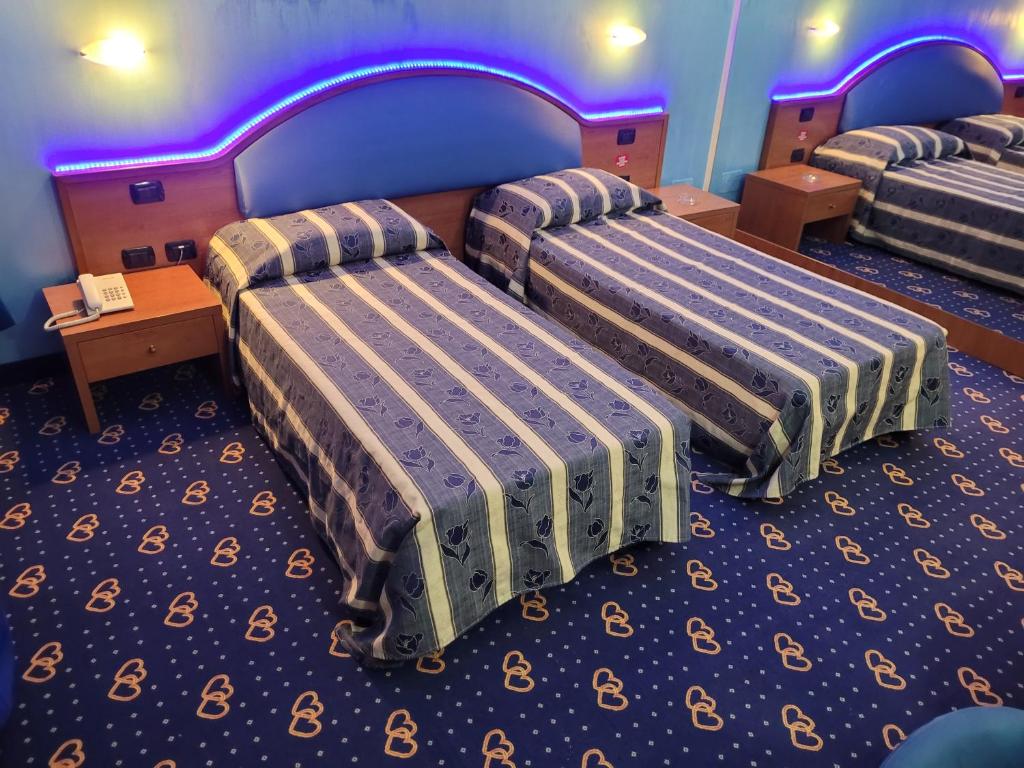 Postel nebo postele na pokoji v ubytování Motel Cuore Gadesco - Hotel - Motel - Cremona - CR