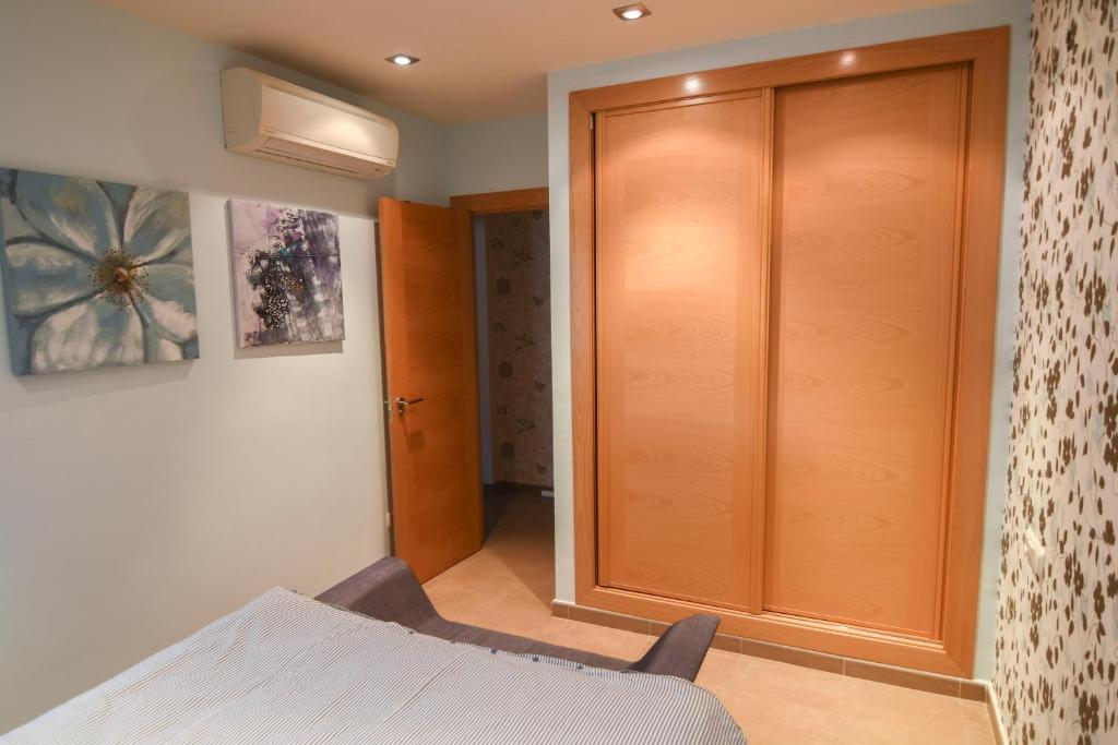 A bed or beds in a room at El Gran Azul - Altea