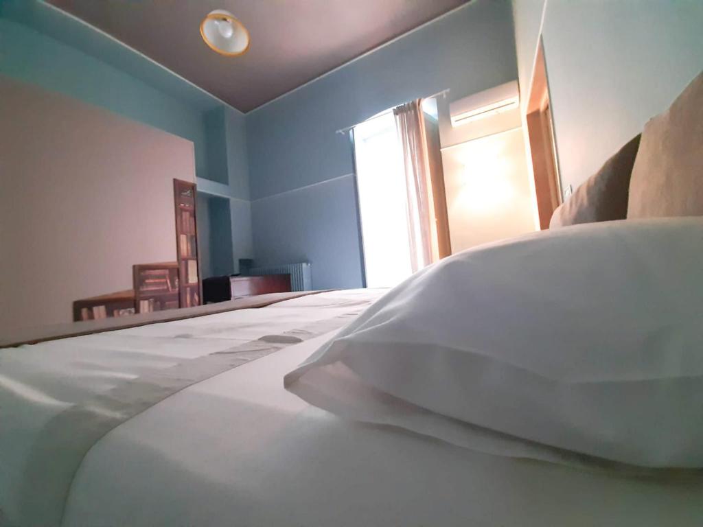Postel nebo postele na pokoji v ubytování Palazzo Romanelli B&B