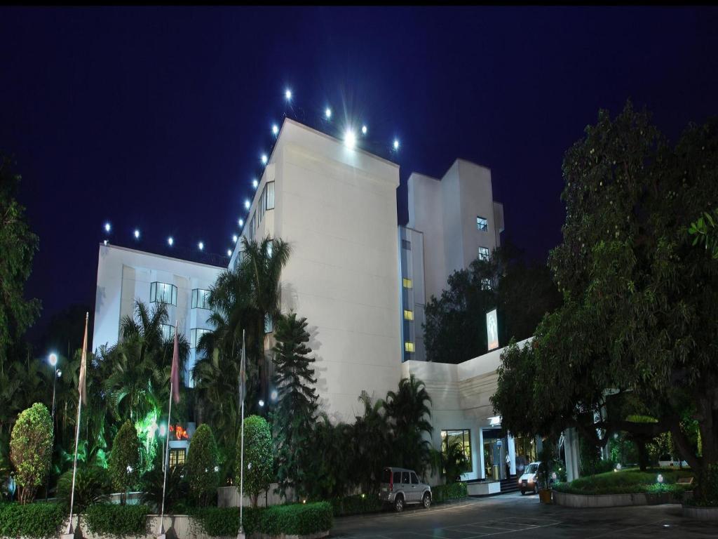 a white building with lights on it at night at Greenpark Visakhapatnam in Visakhapatnam