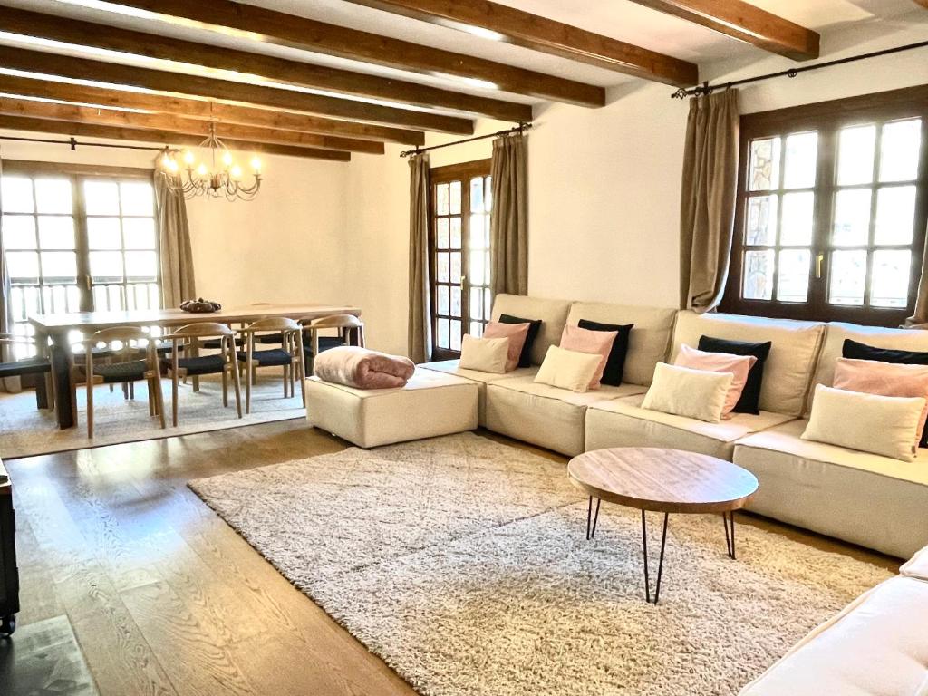 a living room with a couch and a table at Xalet Kotki HUT1-005472 in Canillo