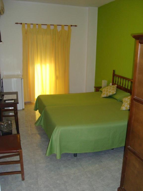 Posteľ alebo postele v izbe v ubytovaní Hostal Durán