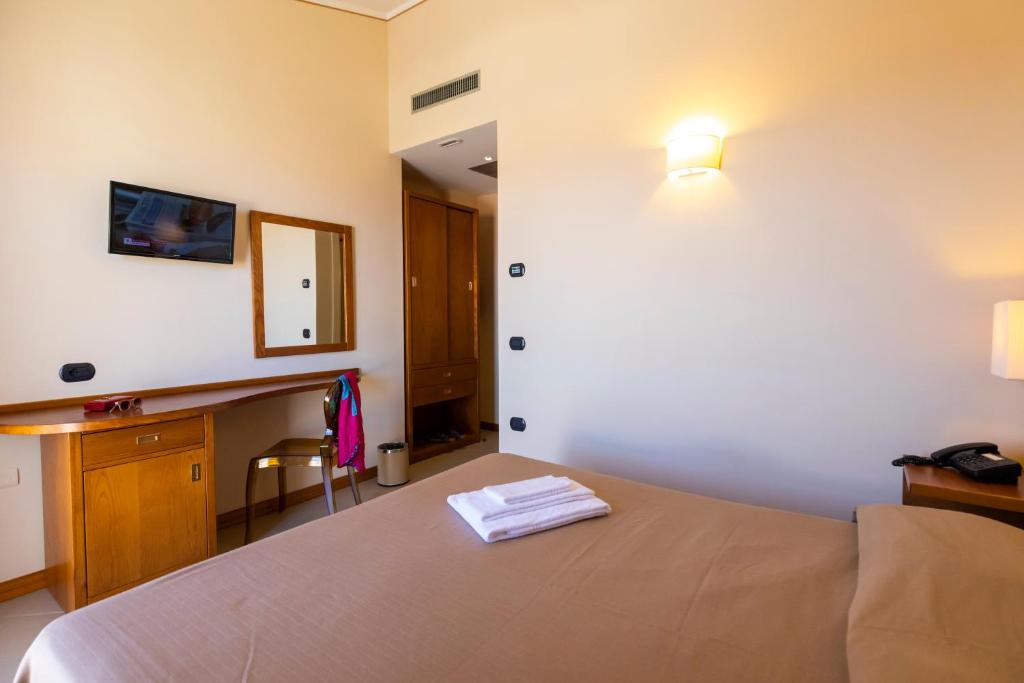 Postel nebo postele na pokoji v ubytování Hotel Tropis