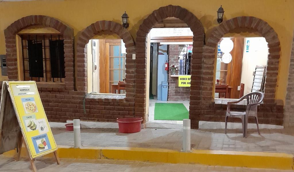 a building with three arches on the side of it at Hotel Los Burritos in Puerto Chicama