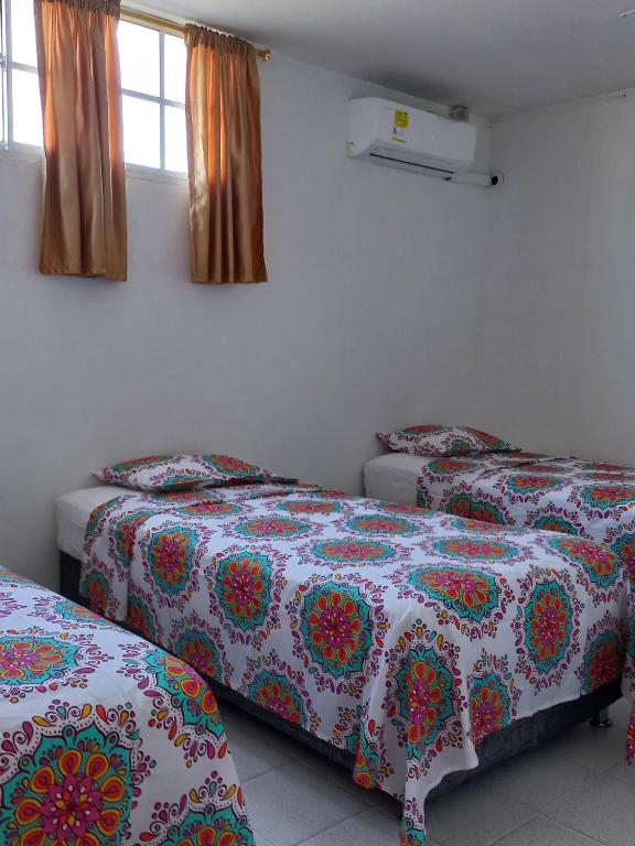 Postel nebo postele na pokoji v ubytování Hostal El Recreo