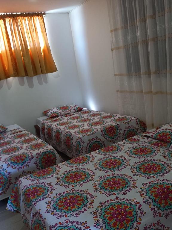 Postel nebo postele na pokoji v ubytování Hostal El Recreo