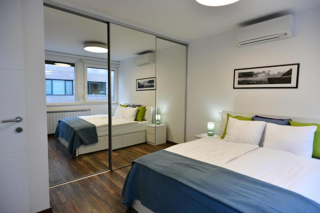 Posteľ alebo postele v izbe v ubytovaní Apartment Larissa
