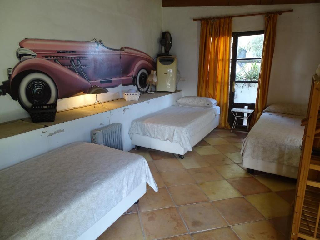 Ένα ή περισσότερα κρεβάτια σε δωμάτιο στο Parador Son Jans Jardin