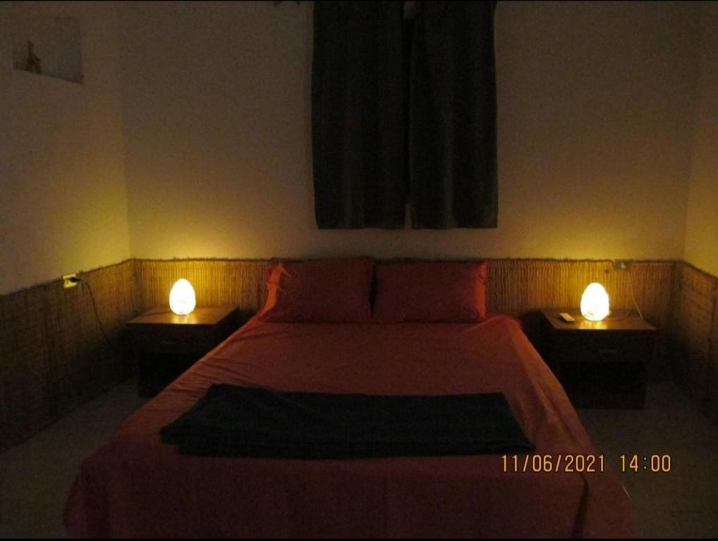 A bed or beds in a room at Luna House Asala Beach