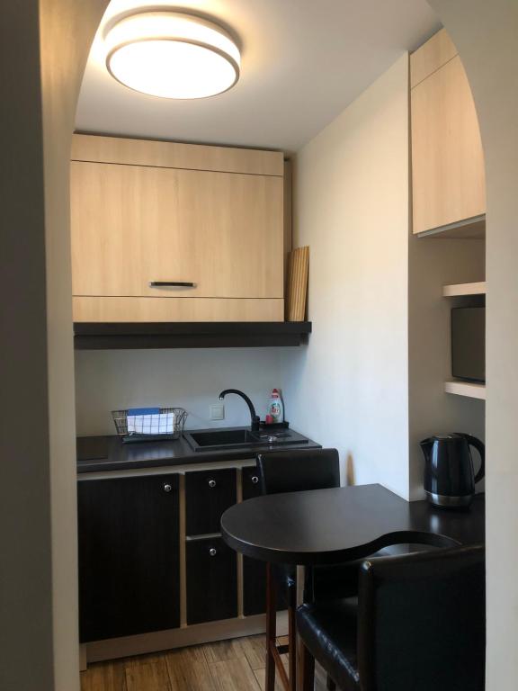 Kuchyň nebo kuchyňský kout v ubytování Arte-locum Apartamenty przy Rynku