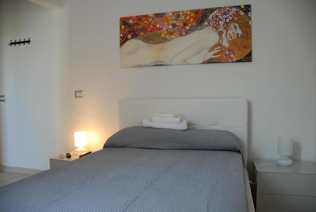 Łóżko lub łóżka w pokoju w obiekcie Messina41 Hotel