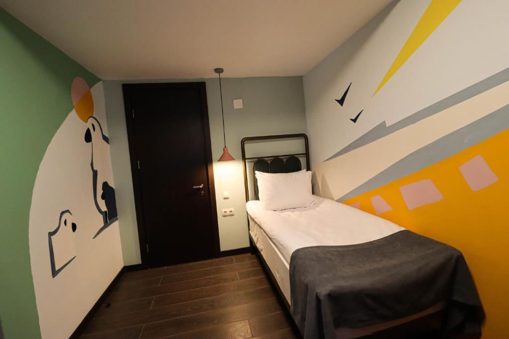 Postel nebo postele na pokoji v ubytování Paliani Hotel