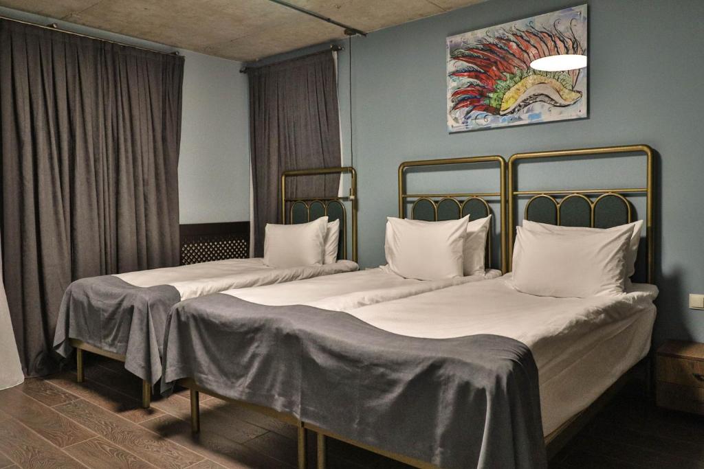 Krevet ili kreveti u jedinici u objektu Paliani Hotel