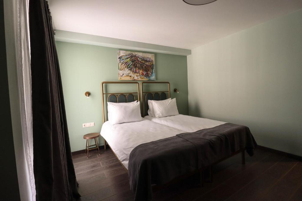 Postel nebo postele na pokoji v ubytování Paliani Hotel
