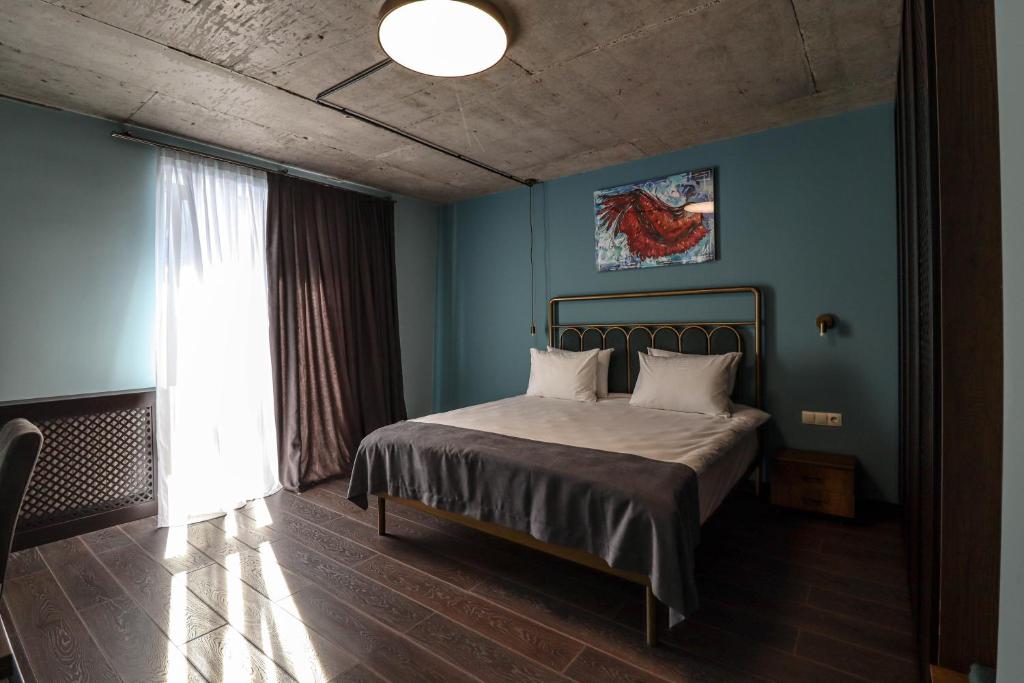 Postel nebo postele na pokoji v ubytování Paliani Hotel